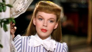 Judy Garland in Meet Me in St. Louis (1944) featuring bangs that were popular then and (thankfully) only then while wearing her best Edwardian garb
